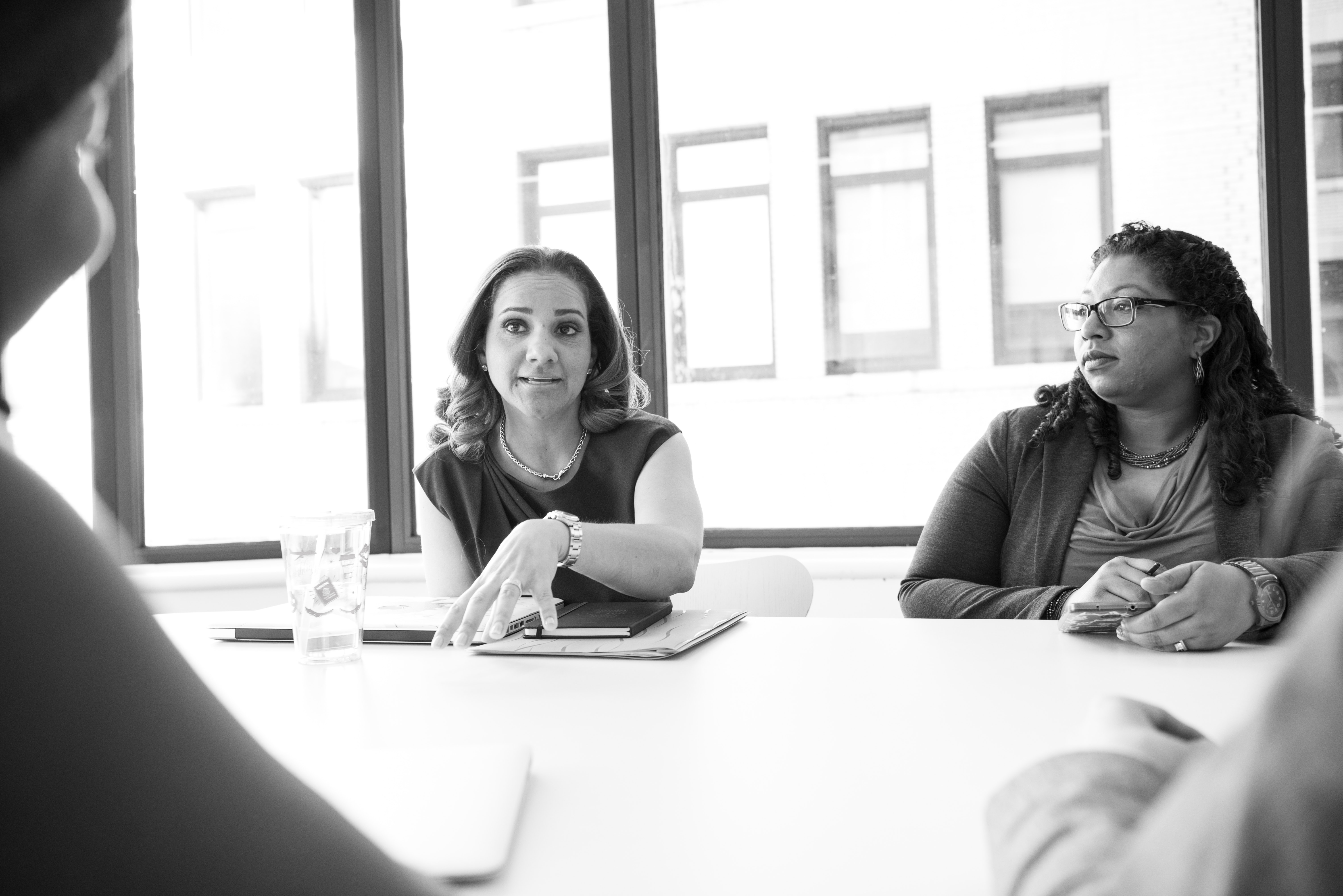black-and-white-discussing-employees-1181612 - B-HUB